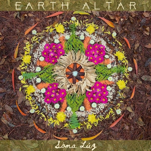 Earth Altar cover, a hand-made flower mandala on the forest floor